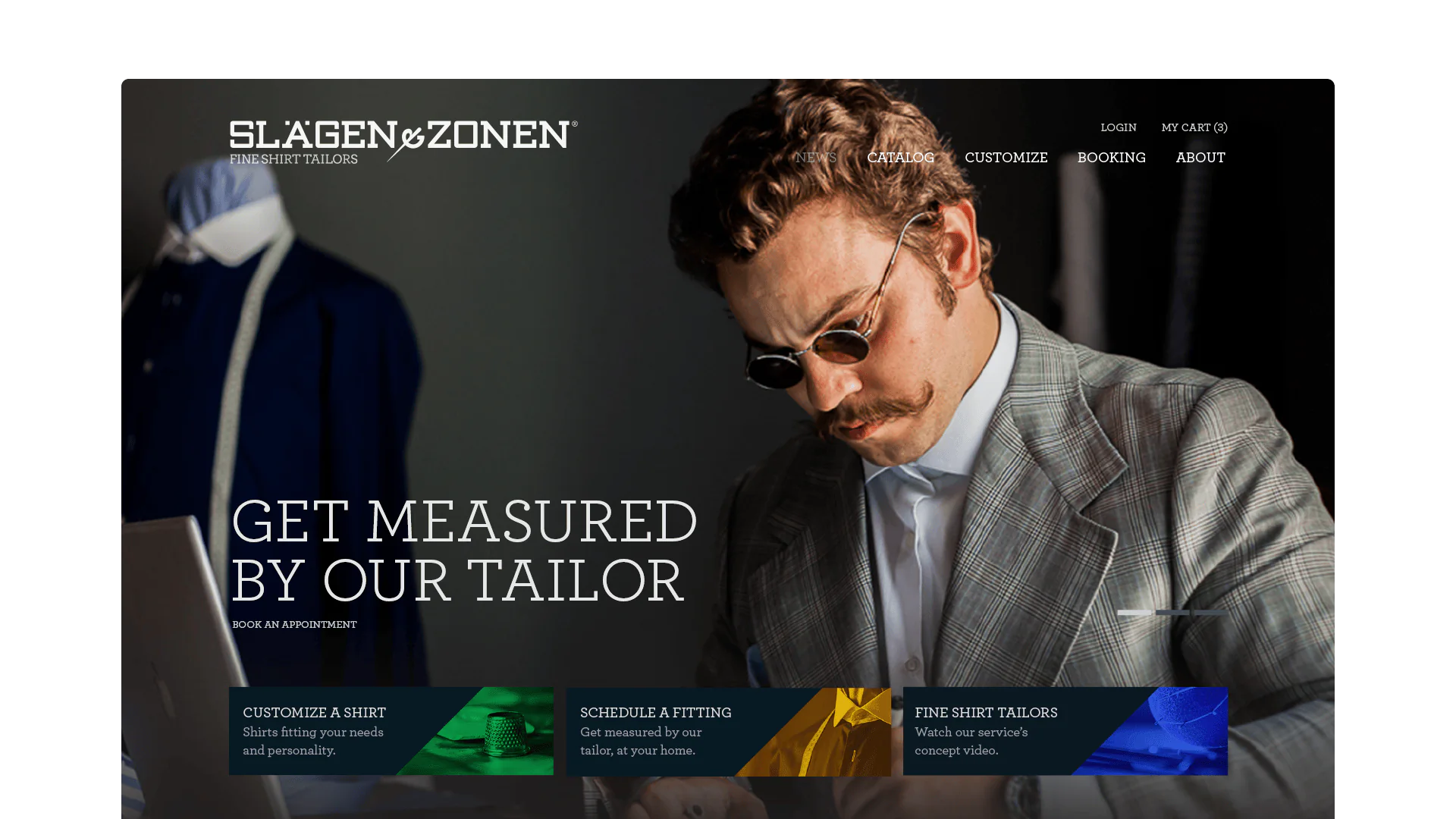 A well-dressed tailor in a grey suit showcases tailored shirts on a sleek website design.
